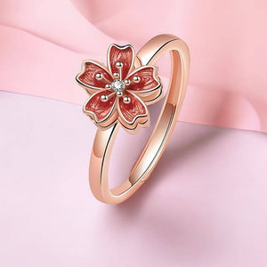 Sakura flower ring on pink background