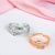 Sterling silver gold and silver worry rings with beads on white background