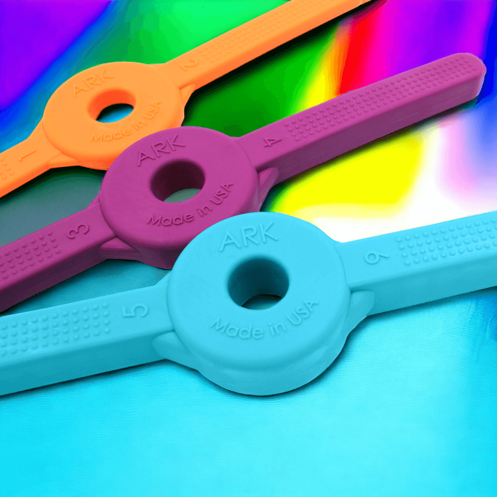 Ark's bite blocks for jaw grading & stability on multicolored background