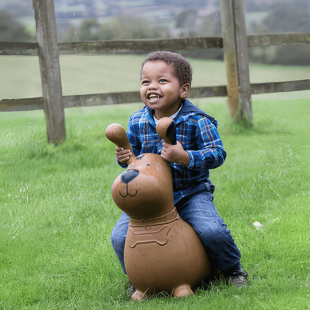Afro american toddler riding Happy Hopperz Brown Dog inflatable animal hopper