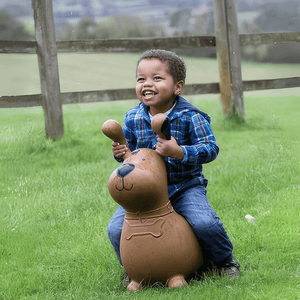 Afro american toddler riding Happy Hopperz Brown Dog inflatable animal hopper