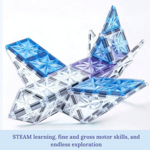 Airplane built of magnetic tiles with frozen theme on white background