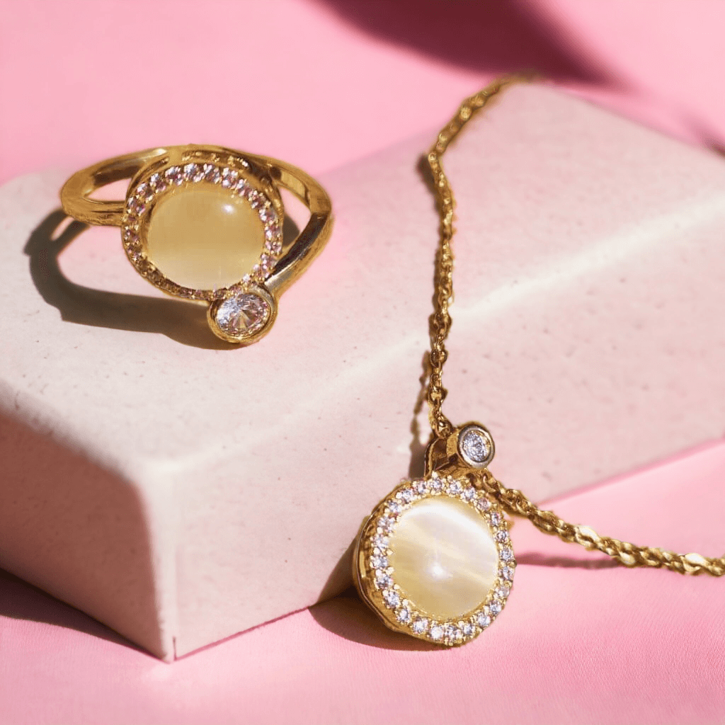 Anxiety jewellery Australia ring and necklace set with opal spinning top on a pink background