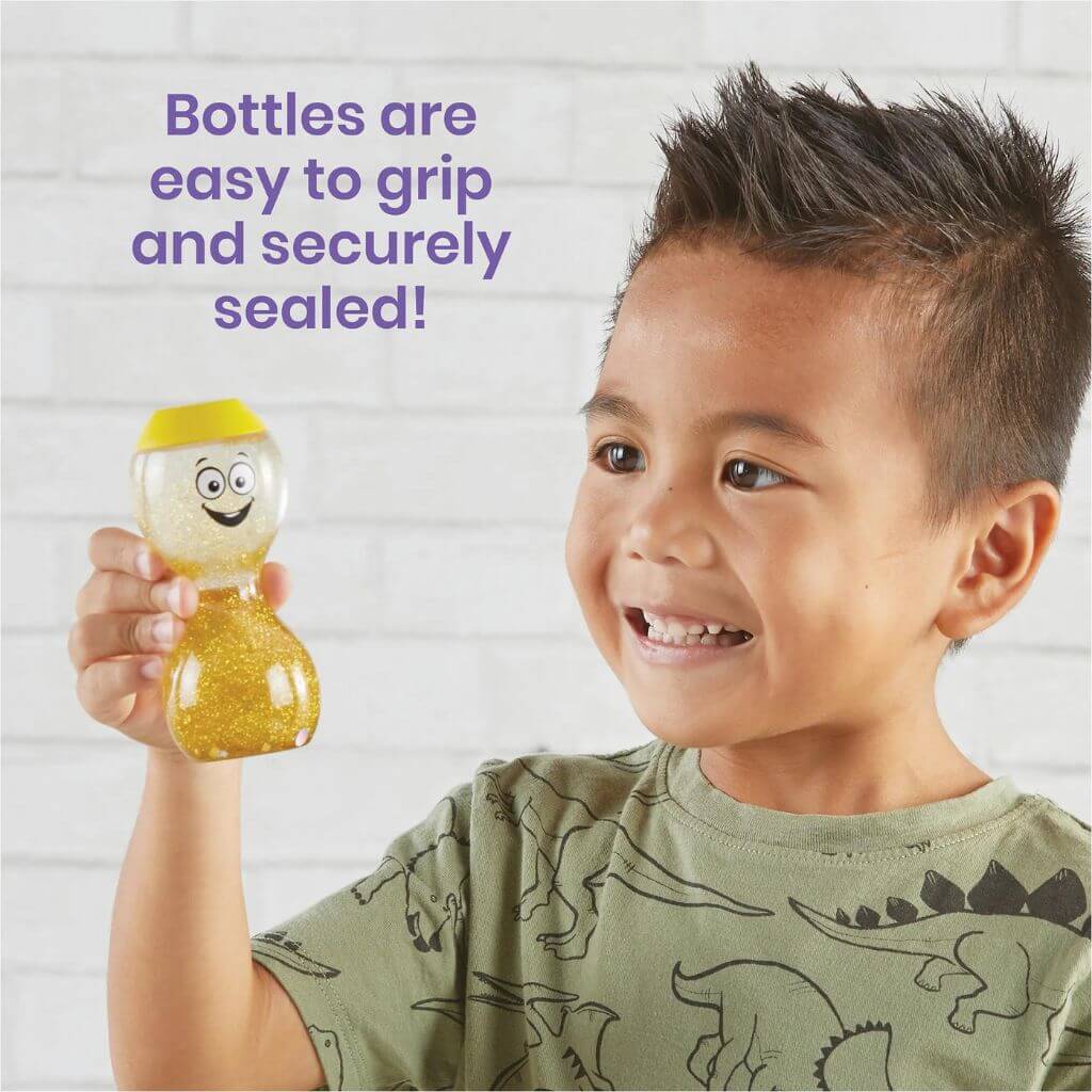 Asian boy holding the yellow Express Your Feelings Sensory Bottle by hand2mind 