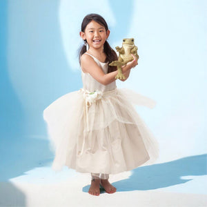 Asian girl holding a funny frog hand puppet from Folkmanis on blue background