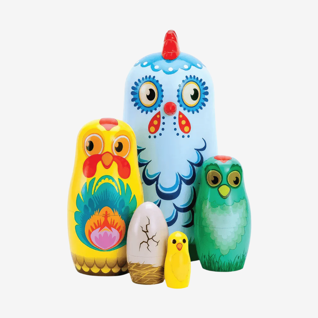 Babushka nesting dolls chickens on white background