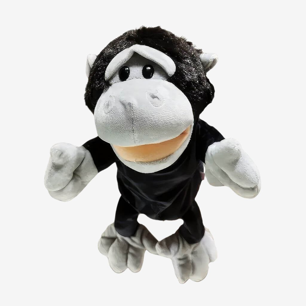 Baby chimpanzee hand puppet on white background