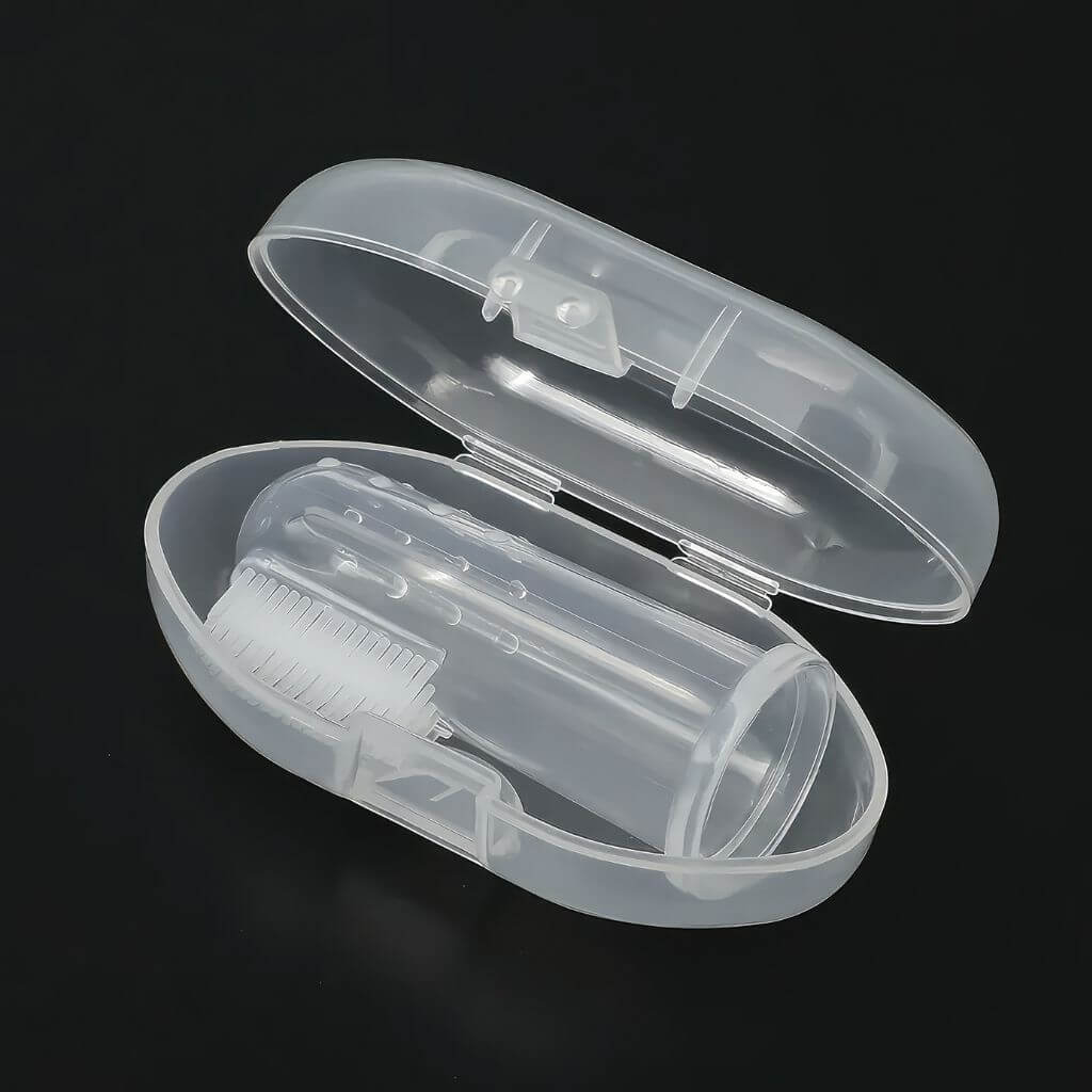 Baby finger toothbrush made of silicone in a white case on black background