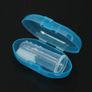Baby silicone finger toothbrush in a blue case on black background