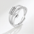 Beaded sterling silver worry ring on grey background