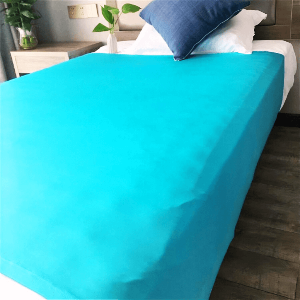 Bed with a fitted blue sensory compression sheet