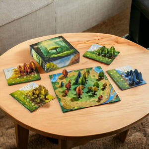 Box and contents of the Photosynthesis board game by Blue Orange on a wooden table