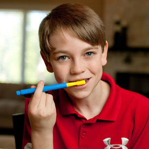 Boy brushing teeth with Ark Z-Vibe hard brush tip