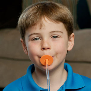 Boy drinking from Ark's Lip Blok Straw Mouthpiece Flexible orange
