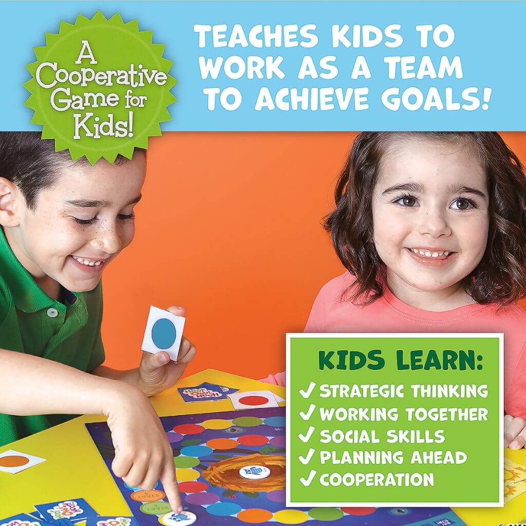 Boy and girl playing Hoot Owl Hoot board game by Peaceable Kingdom 