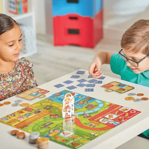 Boy and girl playing Pop to the Shops Game by Orchard Toys