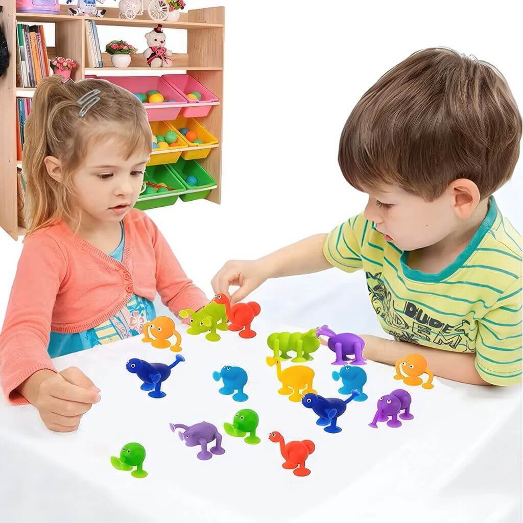 Boy and girl playing with high chair suction toys 