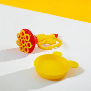 Bubble trumpet blower and tray on a white and yellow background