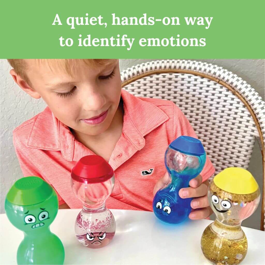 Caucasian boy holding the blue Express Your Feelings Sensory Bottle by hand2mind 
