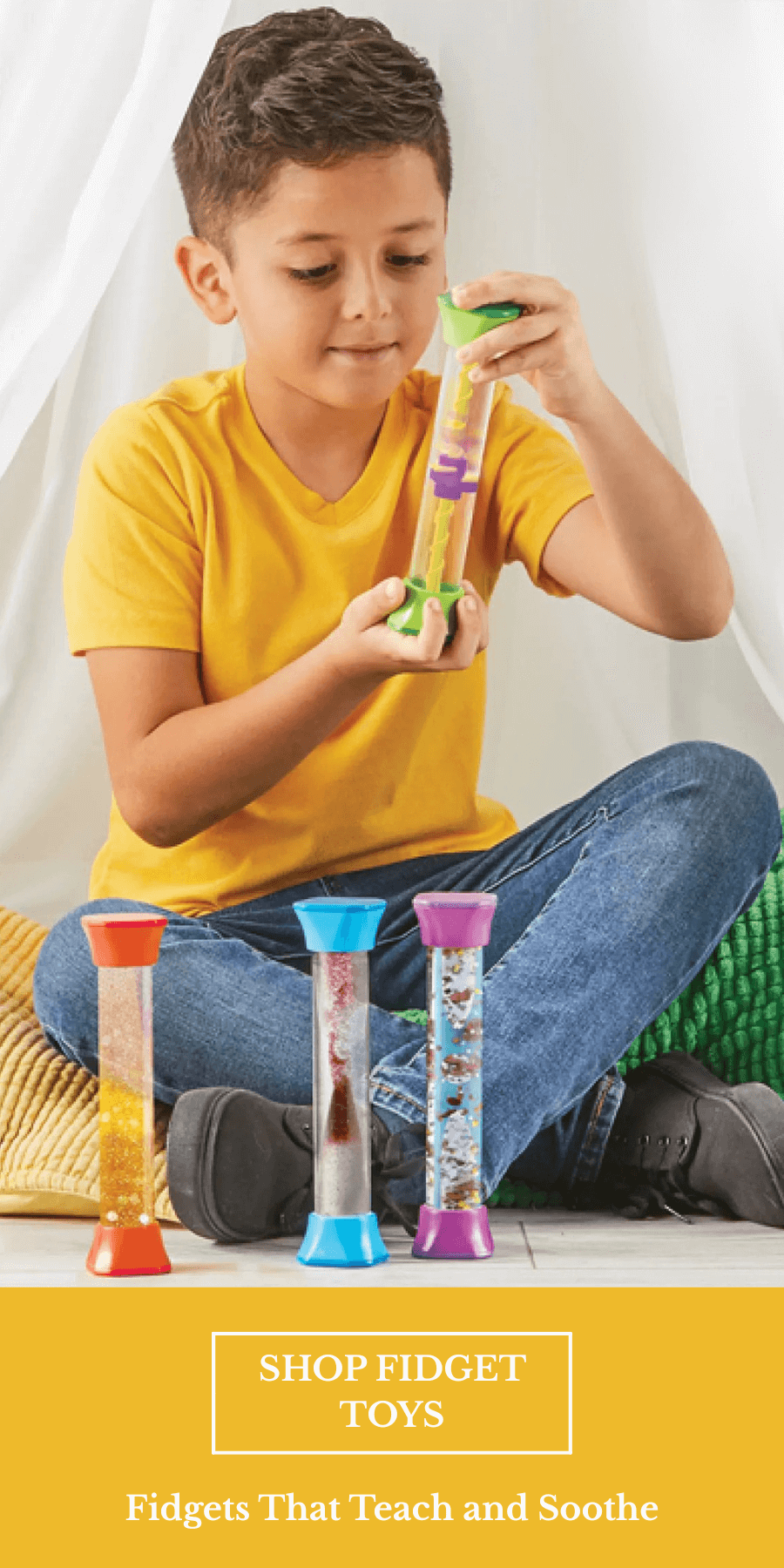 Caucasian boy playing with bottle fidgets under a tent
