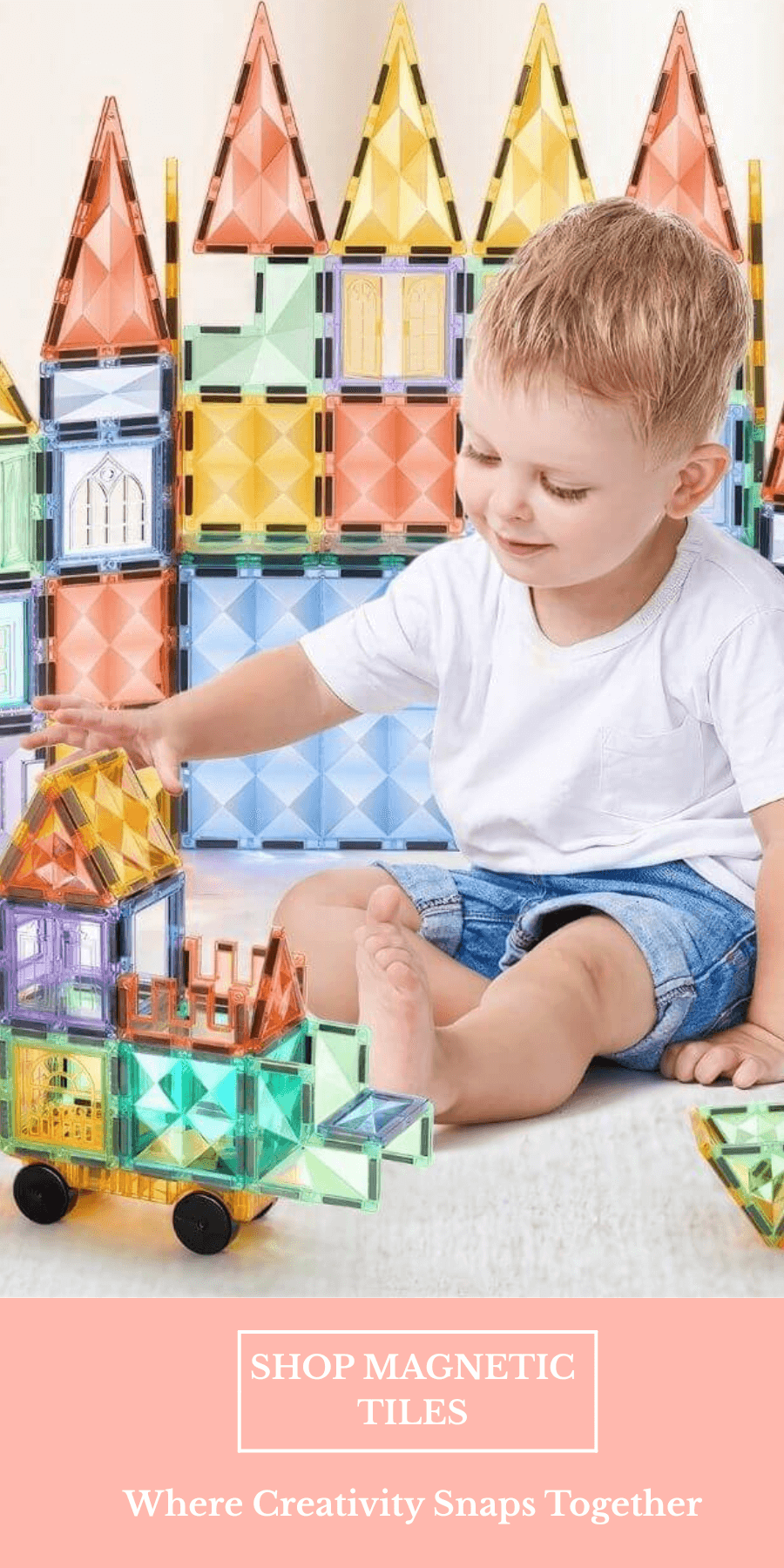 Caucasian boy playing with magnetic tiles on the floor