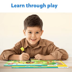 Caucasian boy playing with Skillmatics Search and Find Reusable Activity Mats