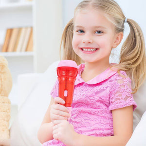 Caucasian girl holding a red echo microphone at a early learning center