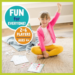 Caucasian girl playing Alphabet Bingo by Peaceable Kingdom  on a jute rug