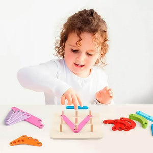Caucasian girl playing with an wooden letters and numbers construction activity set at a table