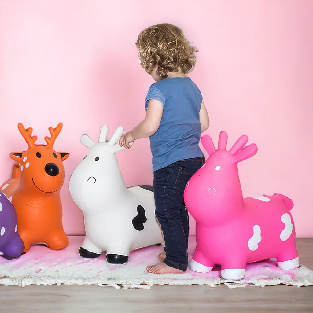 Caucasian toddler next to Happy Hopperz  animal hoppers