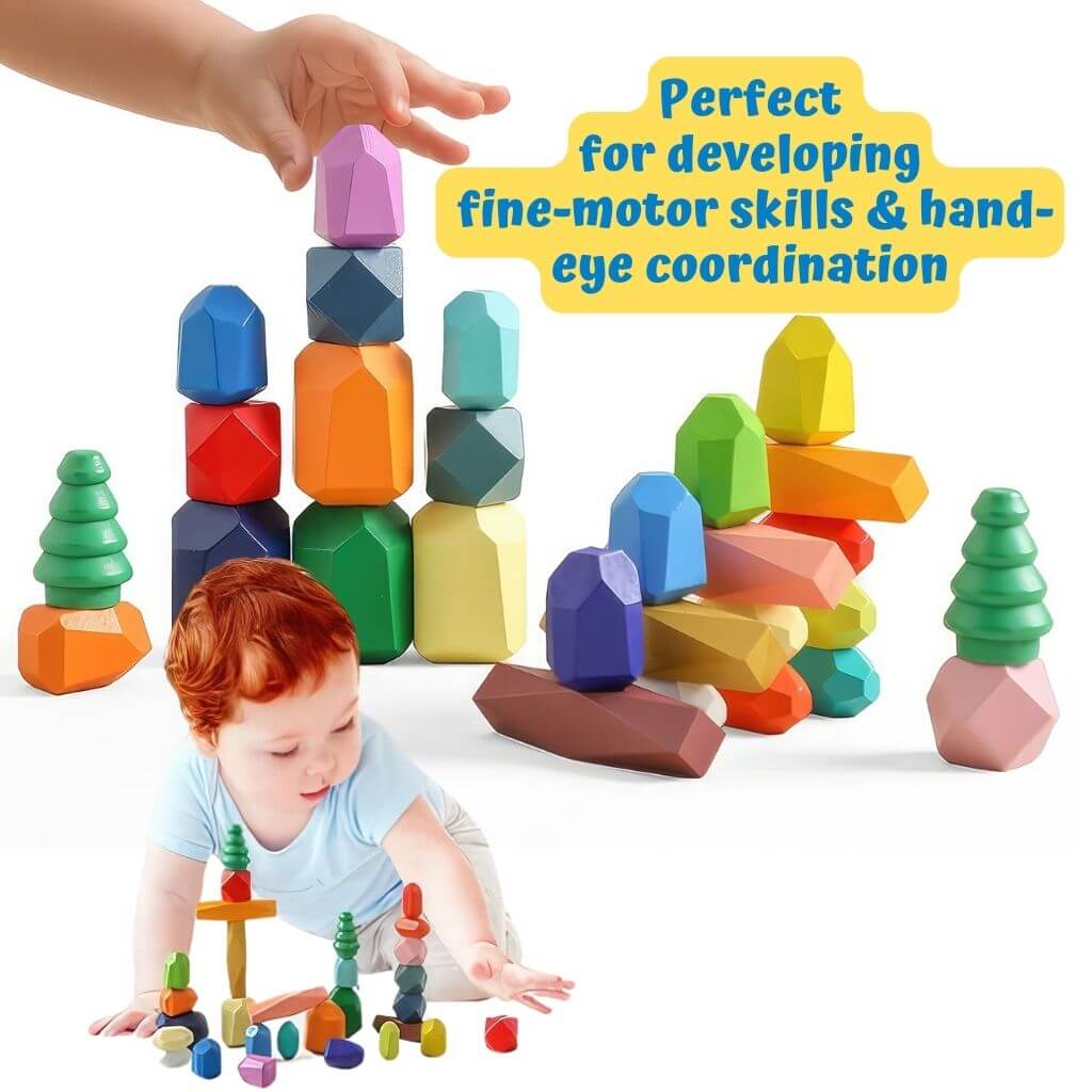 Caucasian toddler boy playing with stacking stones on white background