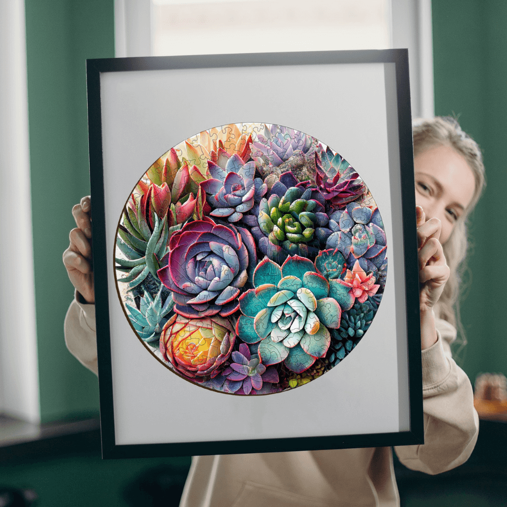 Caucazian woman holding a framed puzzle wooden Succulent Garden