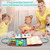 Caucasian women and three children playing with a busy book in Australia