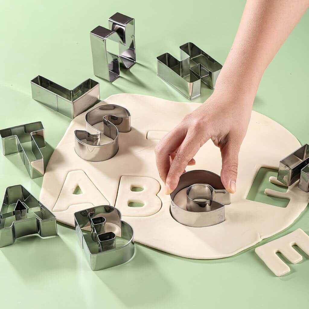Cookie cutter letters on dough