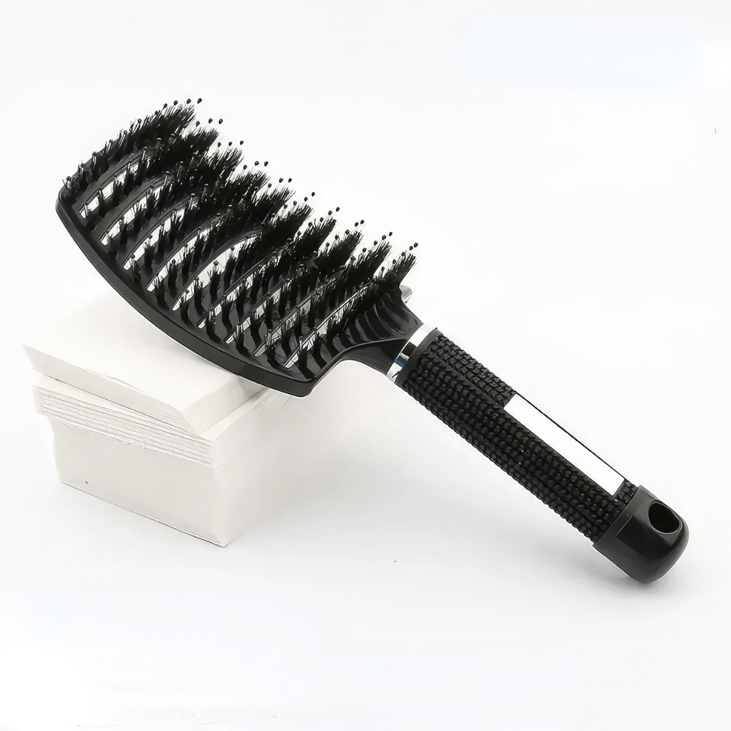 Detangle hair brush  for curly hair black on a stack of white paper