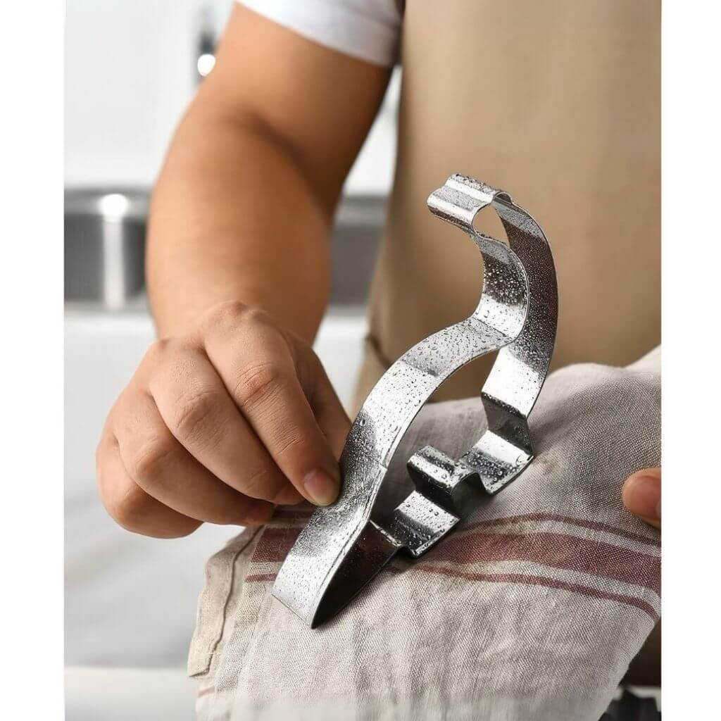 Dinosaur cookie cutter in a child's hand