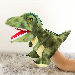 Dinosaur open mouth hand puppet on a hand on a grey rug