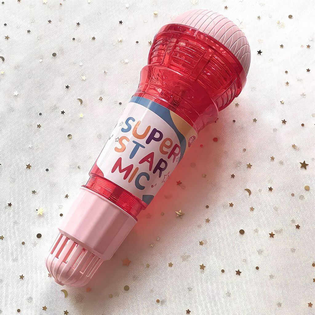 Echo microphone toy red on a golden stars surface