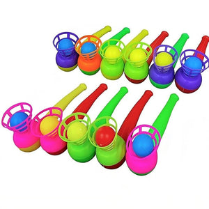 Eleven multi colored magic ball blow pipes on two rows on a white background