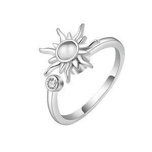 Fidget ring for anxiety sun with spinning top on white background