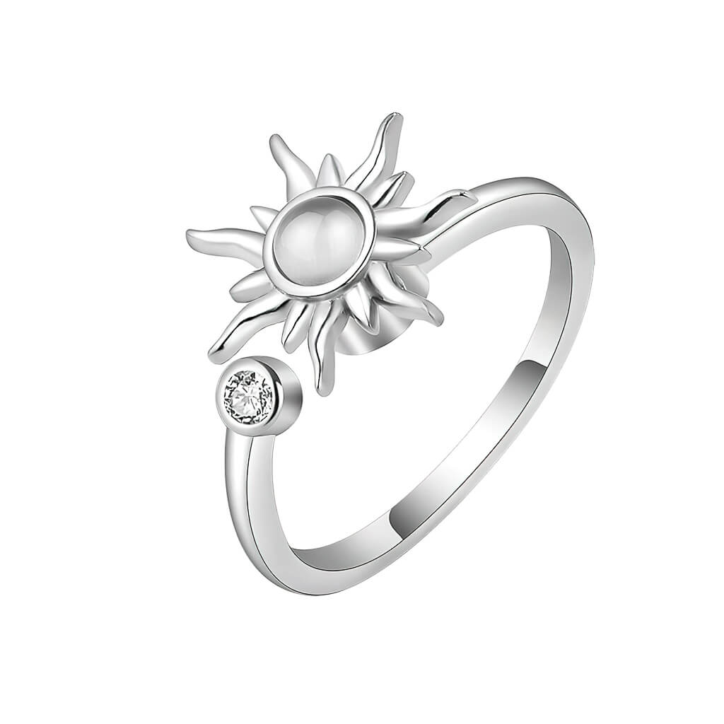 Fidget ring for anxiety with sun spinning top on white background