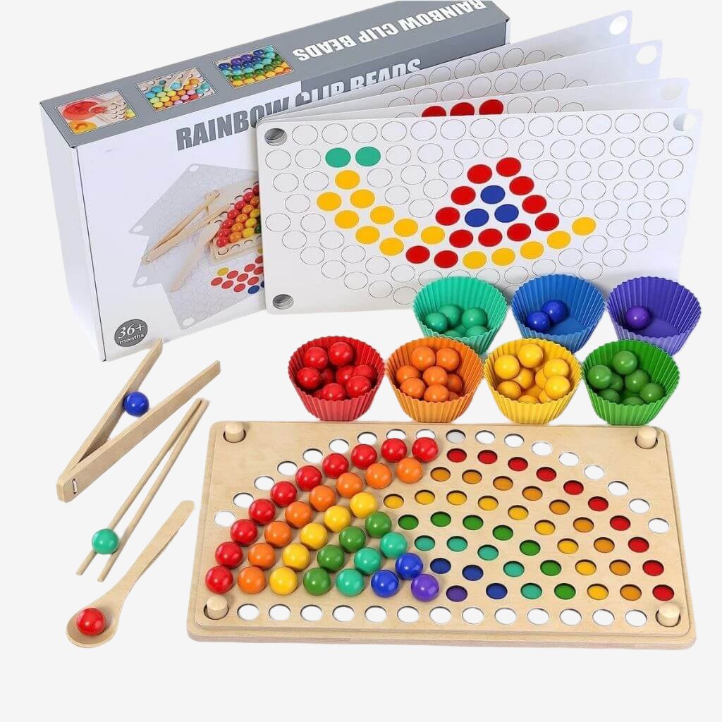 Fine motor toy with wooden balls and patterns with box on white background