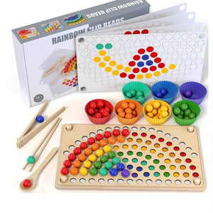 Fine motor toy with wooden balls and patterns with box on white background