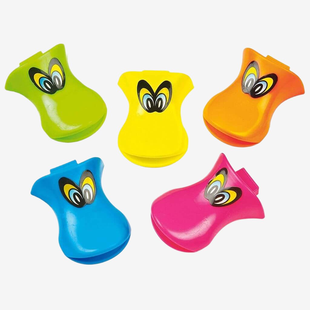Five multicolored duck beak whistles on a white background