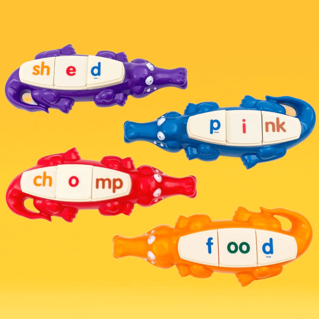 Four alligators from the Spelligator spelling game by Junior Learning on yellow background