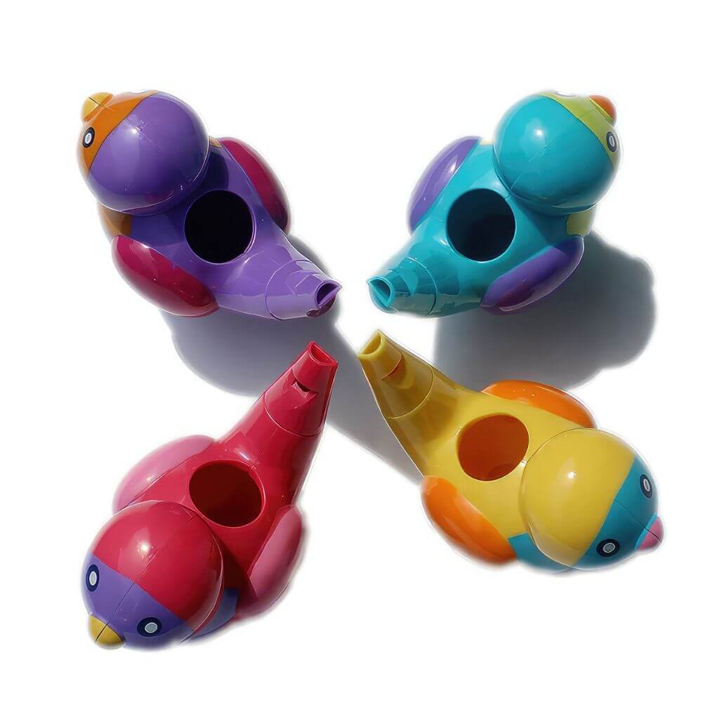 Four multi coloured bird water whistles on white background viewed from above
