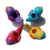 Four multi coloured bird water whistles on white background viewed from above