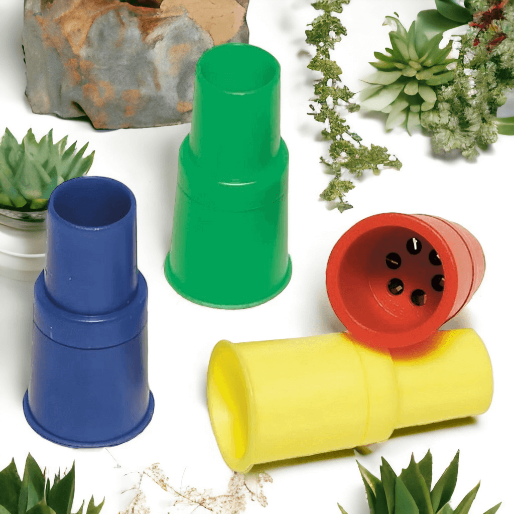 Red, yellow, blue, green siren whistles on a white background