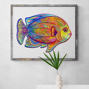 Framed fish puzzle mounted on a gray wall close up