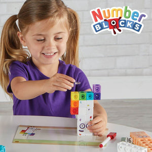 Girl building mathlink cubes numberblocks eleven to twenty on a white table